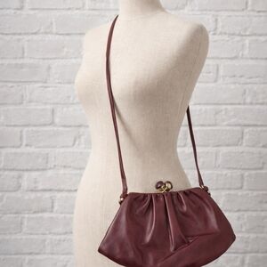 Vintage gathered leather clutch with gold-tone kiss-lock closure